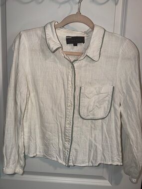 Sunday in Brooklyn black label with pale green script on white fabric